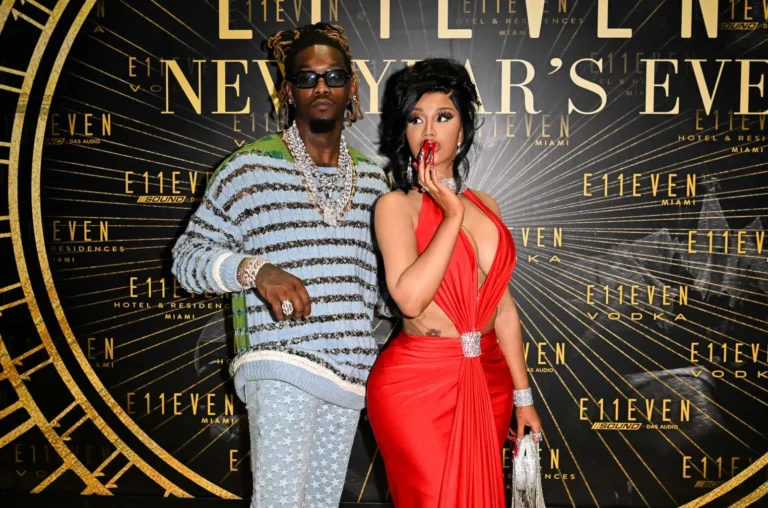 Offset performing on stage wearing black hoodie with microphone, lyrics from ‘Move On’ on screen behind him.”